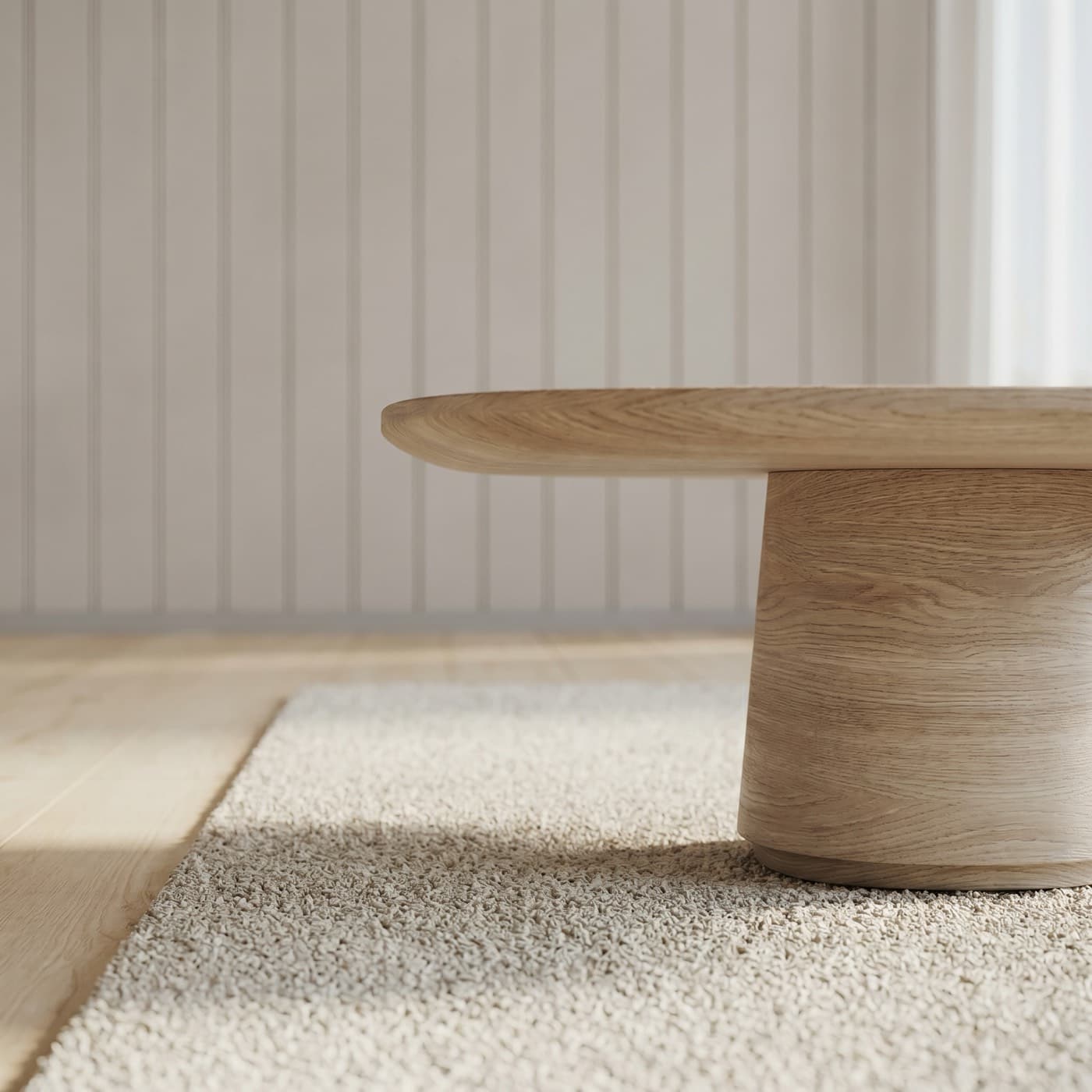 Oak table detail on a textured rug